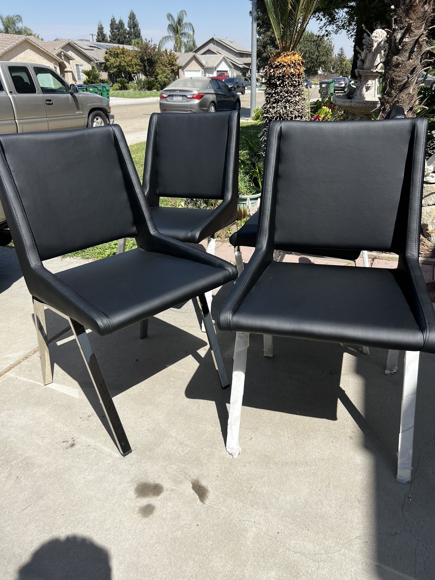 Brand New! (Set of 4) Contemporary Leatherette Dining chairs. $399