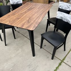 Brand New. Mid Century Modern walnut Dining Table With 4 chairs. Set retails over $1200   