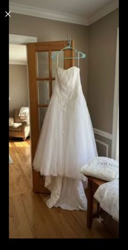 white strapless ball gown wedding dress from David's Bridal featuring
