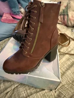 Brand new lace up boots with a side zipper