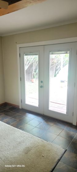 Double door exterior with blinds in glass