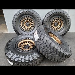 17" KMC rims w/ 35" Toyo MT Open Country Tires