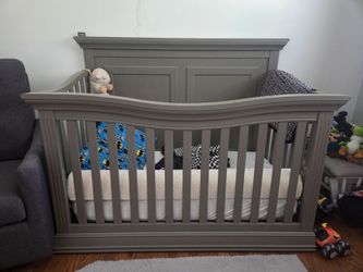 Nursery convertible crib and dresser
