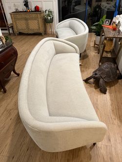 Crate and barrel sofas , with some tears and wear on them.