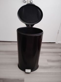 Metal black trash can..