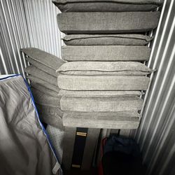 Dark green couch with 2 ottomans