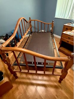 Free Twin wood bed w/2nd bed on wheels