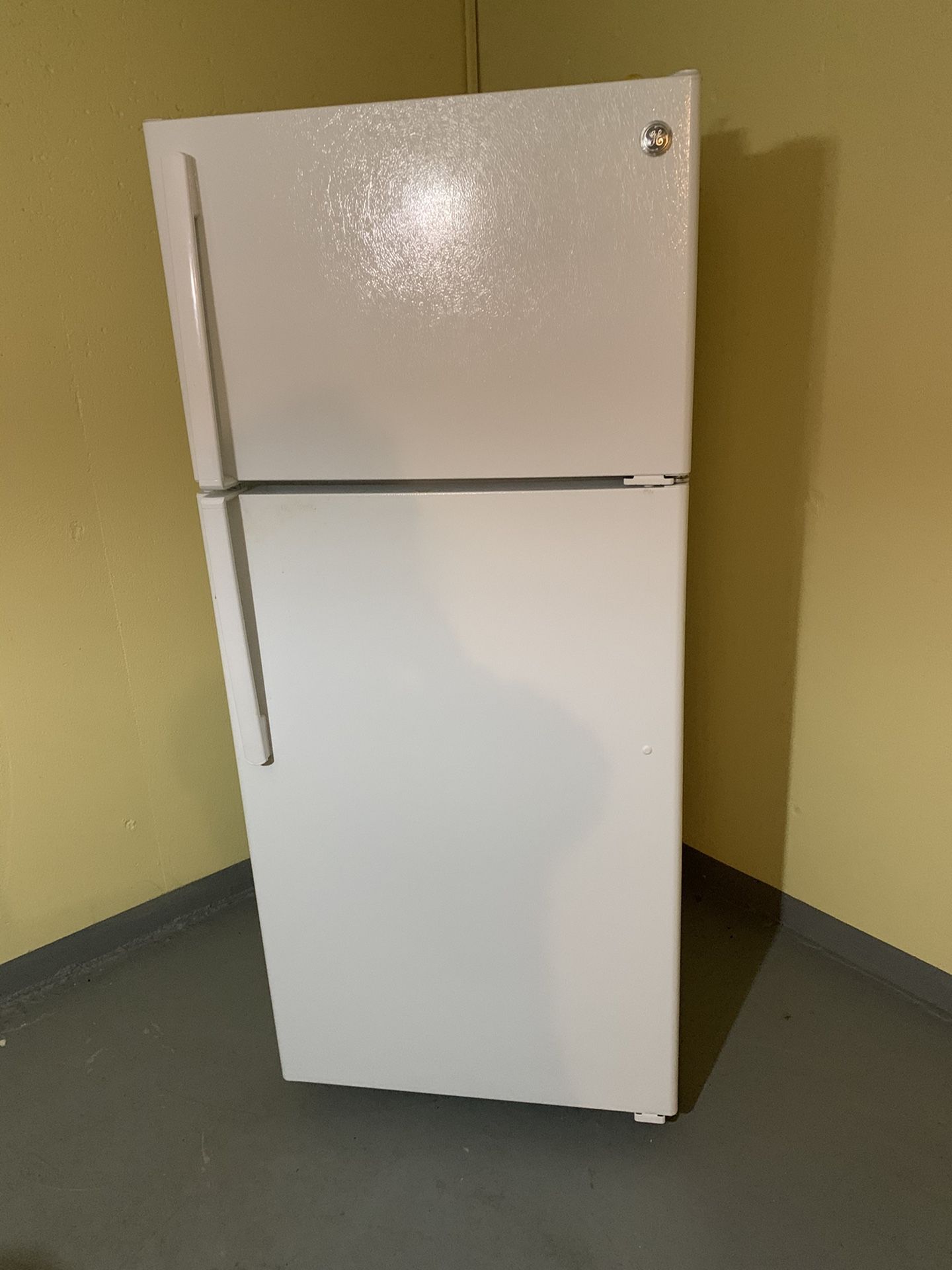 G.E, very good refrigerator less than two years old. Dimensions are: 64/28 inches.