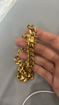 Lightly. Used cuban link steel gold plated cadena