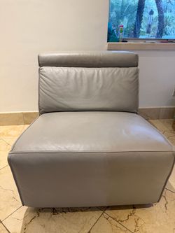 Grey leather lounge chair solo piece