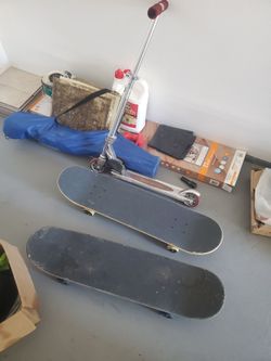 Scooter, bike and two skateboards