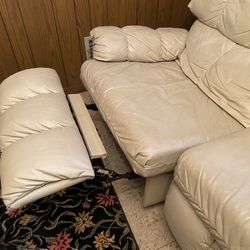 Leather Sectional With  A Recliner In Side And A Full Size Pullout Bed 