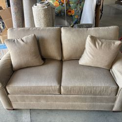 brown fabric love seat 
