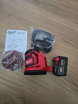 Milwaukee ml& orbital sander with battery 
neW