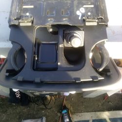 Cigarette and cup holder with lighter.