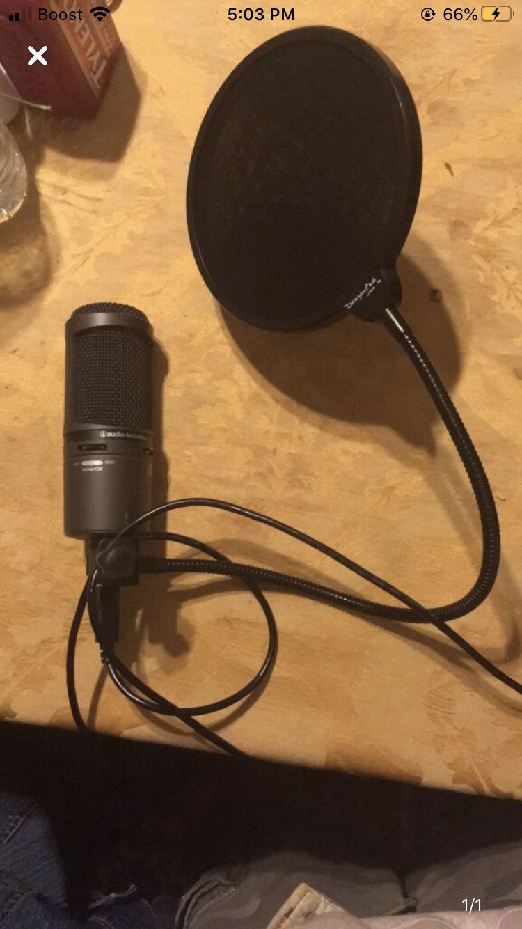 Black and Gray Microphone with stand