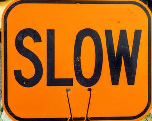 Orange "SLOW" Sign