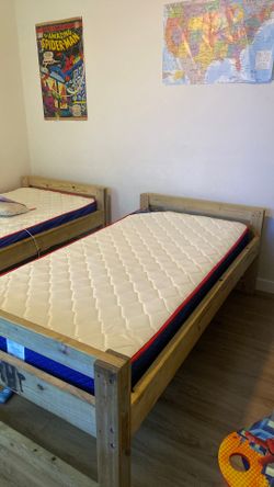 Wooden twin bed with mattress
