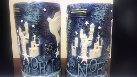 Two “Noel” hand painted pillar candle holders with battery operated tea lights