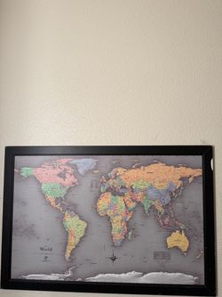 World map in a black frame. Small chip on the frame. #worldmap #geography
