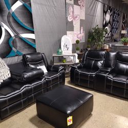 2 piece black sofa and love seat. Sofa has  drop down storage piece in the middle and the  loveseat has cup holders in the Middle 
Dimensions : 41"H x
