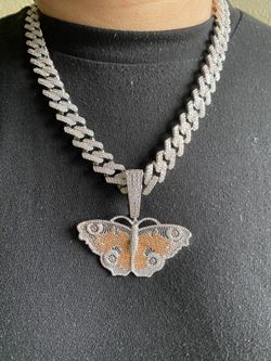 Iced out butterfly pendant with Cuban link chain