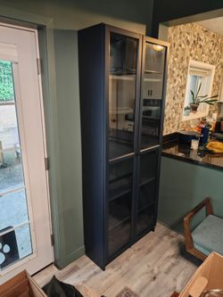 BILLY bookcase with glass doors, dark blue