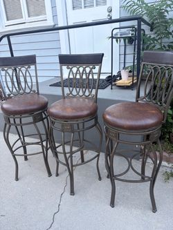 Set of 3  Swiveling Bar Stools- vintage look $120 OBO
