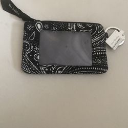 A Small Black Wallet With White Designs