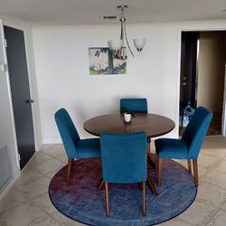 Lyncott Mid Tone Round Table & Teal Upholstered Side Chairs
