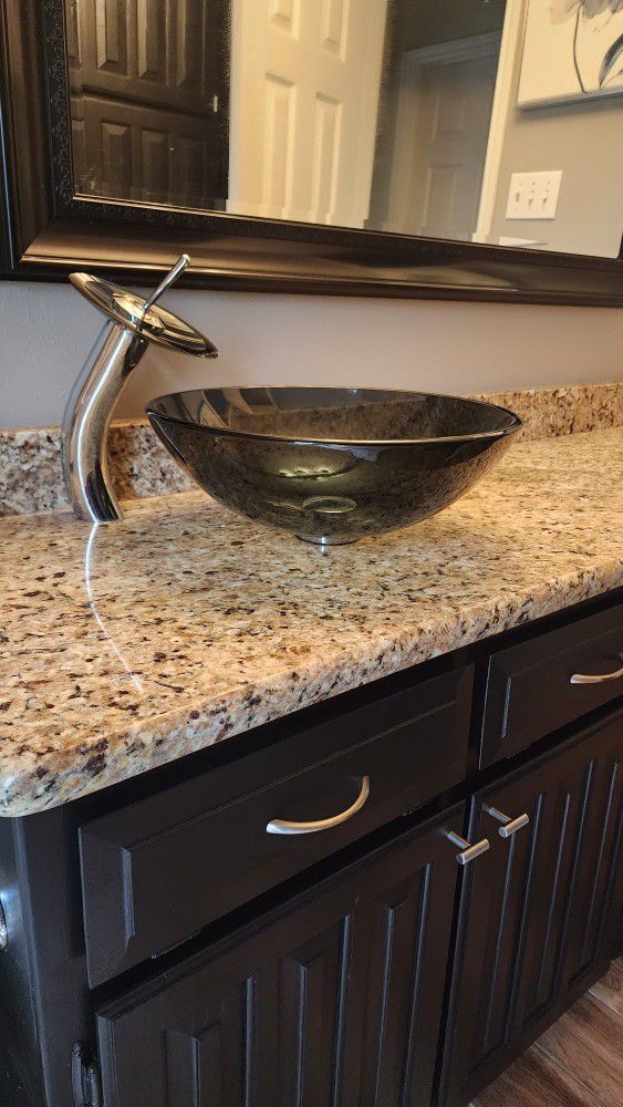 Contemporary glass sink and faucet w/ pop up drain in brushed nickel.  NICE