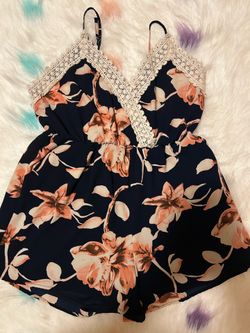 Women's size S jumpsuit with floral lace details