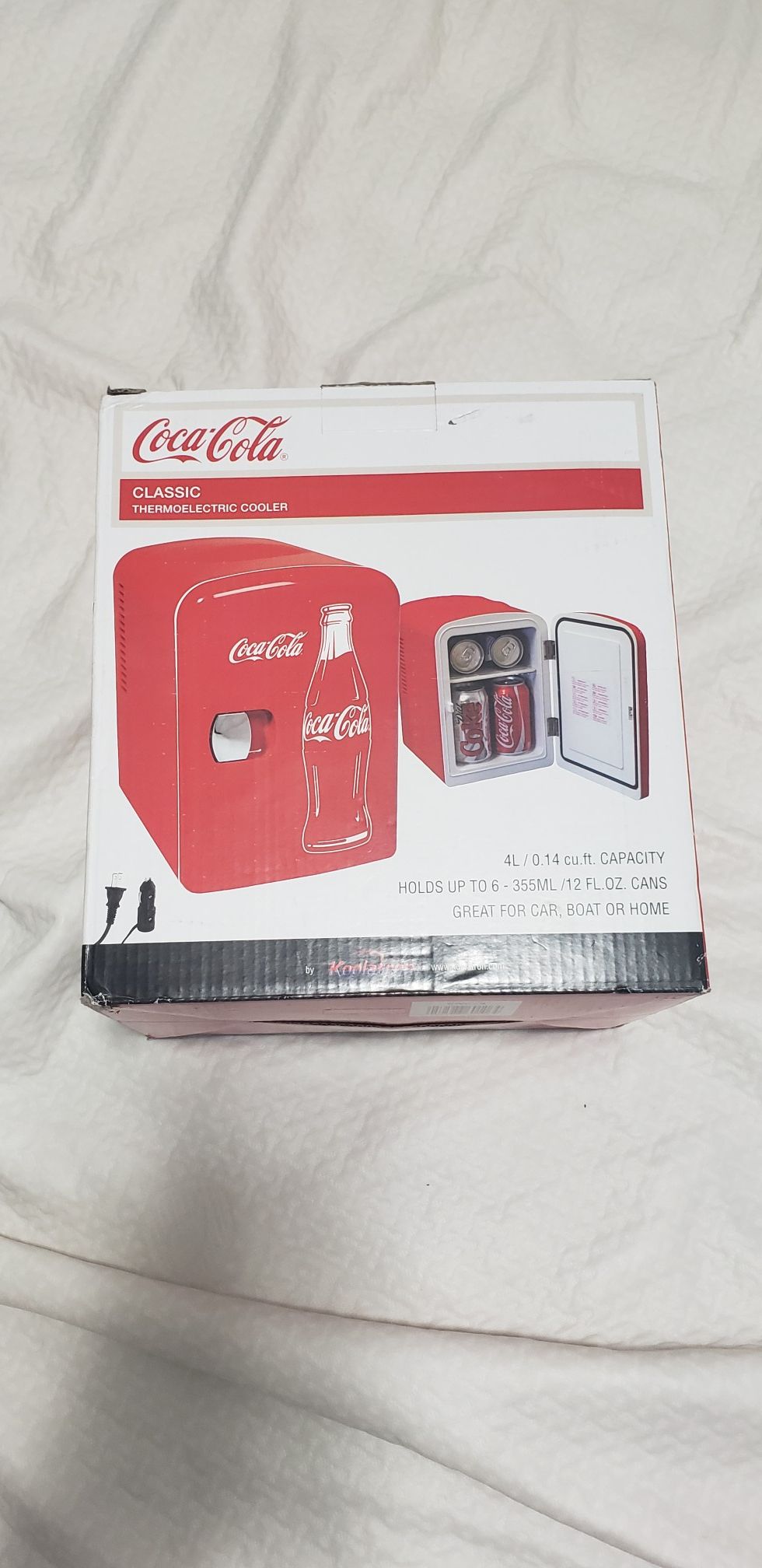 Brand new Coca Cola 6 can mini fridge w/ car adapter