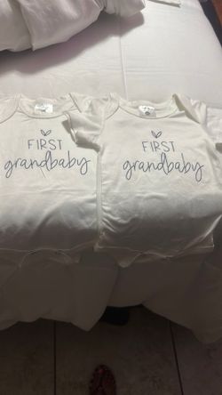 New new born first grandbaby onesie size XS 3 dollars for 2