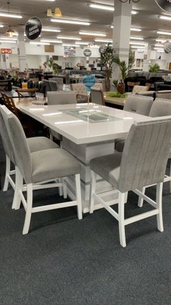 New table with 6 chairs .