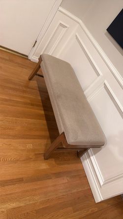Upholstered wood bench.