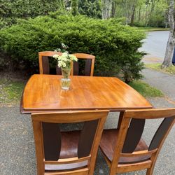 Wooden table and four chairs