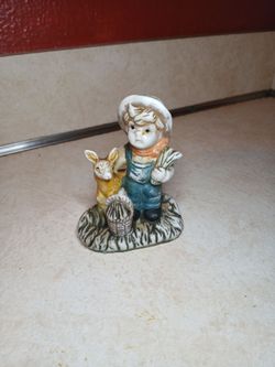 Country Boy ceramic figurine with a deer