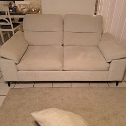 Cream colored love seat