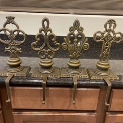 4 Vintage cast iron  stocking holders 