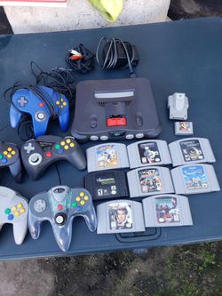 1 Game. 2 Controller & red Graphics Card. $180 firm Nintendo N 64 N64 extra Game is $30!. Extra control $25. Memory card is $25. Do the math. Total $5