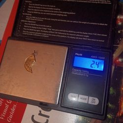 2.4 Grams Of 14k Yellow Gold Half Heart Pendant 