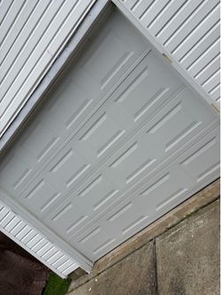 Garage door with hardware and springs