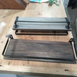 Set of rustic industrial floating wall shelves.
