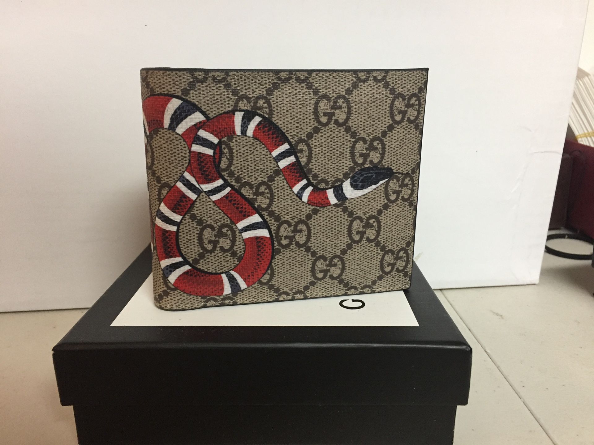 Gucci brown monogram men’s snake wallet