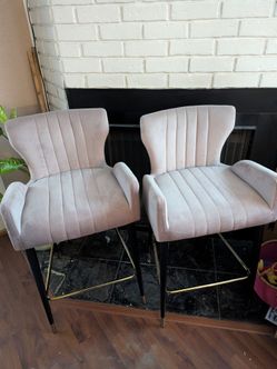 Pink velvet stools with black and gold legs