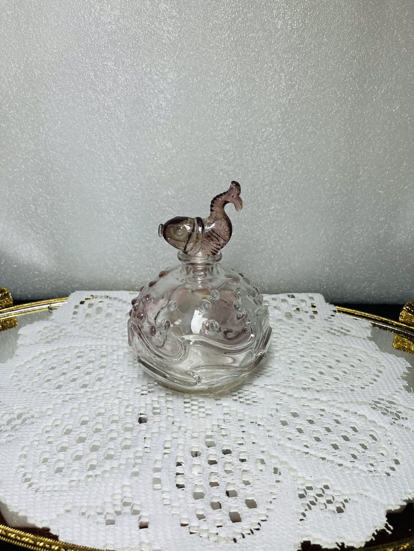 Vintage Art Deco Glass Perfume Bottle with Ocean Wave Pattern and Decorative Fish Stopper