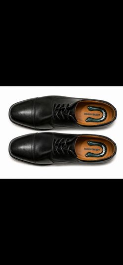 Classic black leather Oxford dress shoes featuring a sleek cap-toe design, lace-up closure, and polished finish. Perfect for formal occasions, busines