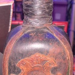 Vintage Italian Leather Covered Wine Bottle Bar Decanter Brown. In good condition and really a seriously cool piece approximately 10 in high. Made in 