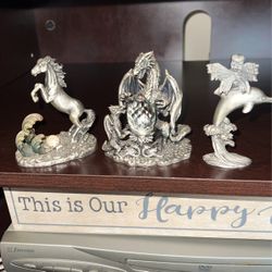 pewter statues approx 3 in tall crystal ball in dragons hards for all 3 28$ or sold seperate9$ ea